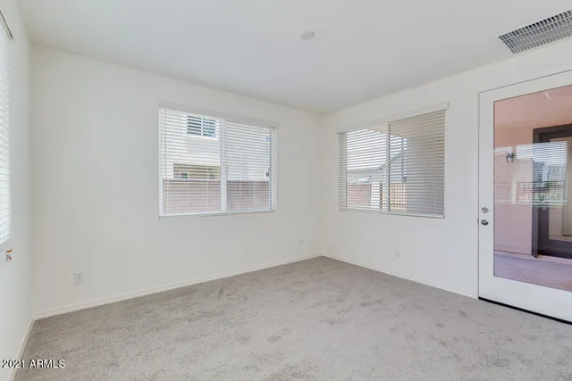 a view of empty room with windows