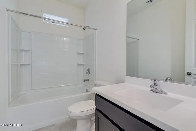 a bathroom with a sink a toilet and a bathtub