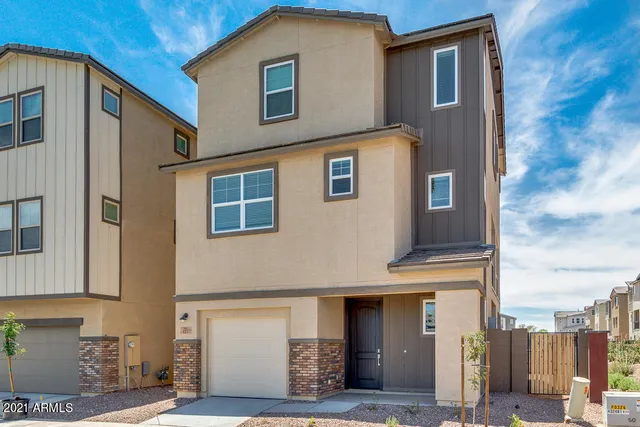 a front view of a house with a garage