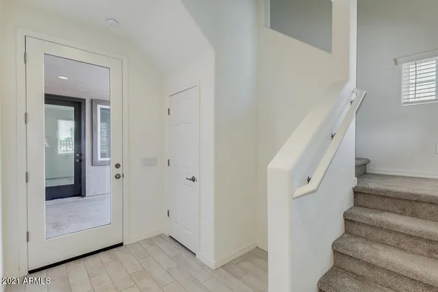 a view of entryway with wooden floor