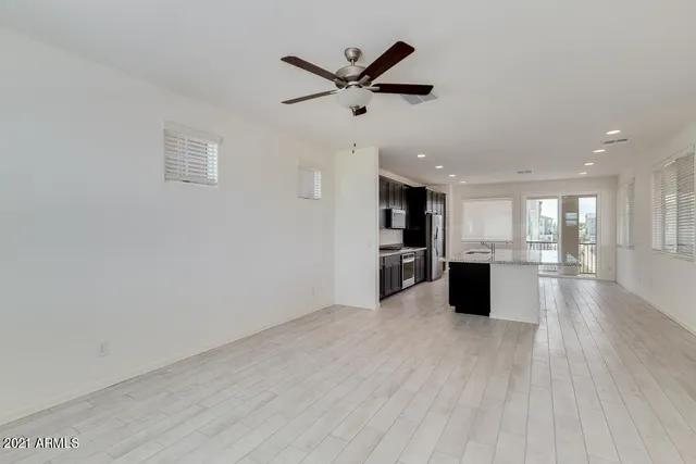 a view of kitchen with wooden floor and window