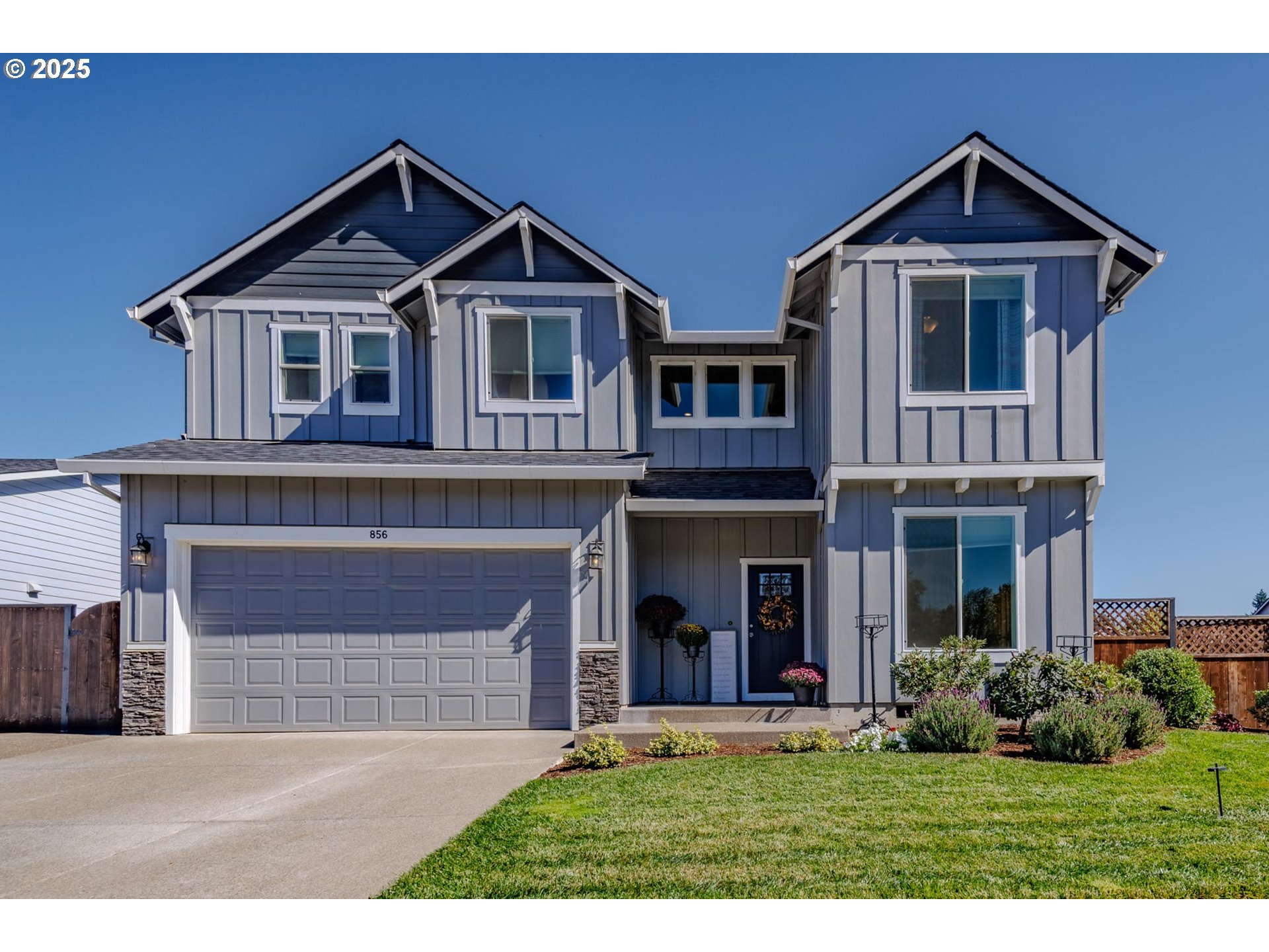 856 Maple Street Brownsville, OR 97327 - Photo 1 of 47 a front view of a house with a yard and garage