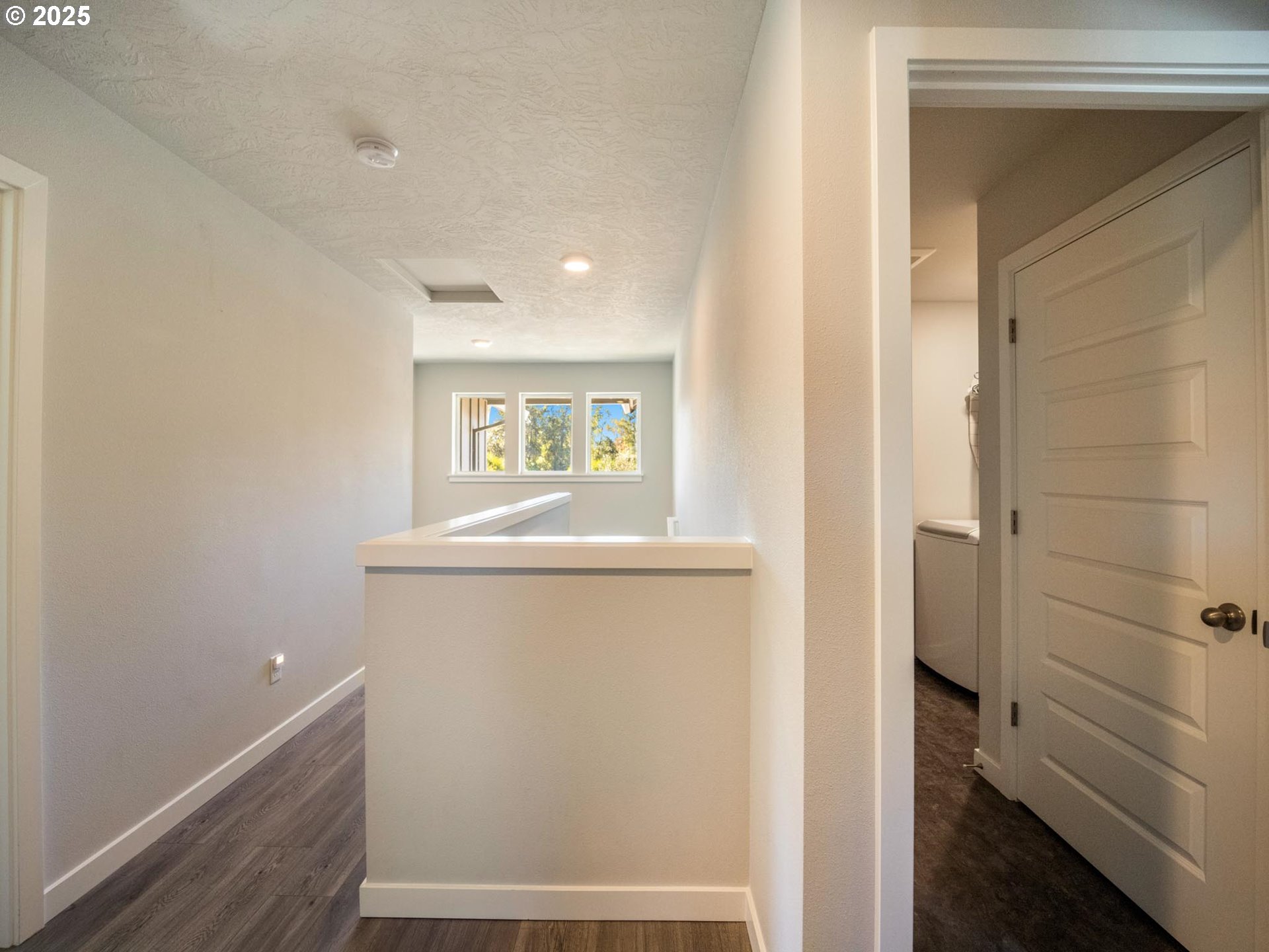 856 Maple Street Brownsville, OR 97327 - Photo 11 of 47 a view of hallway with window and wooden floor