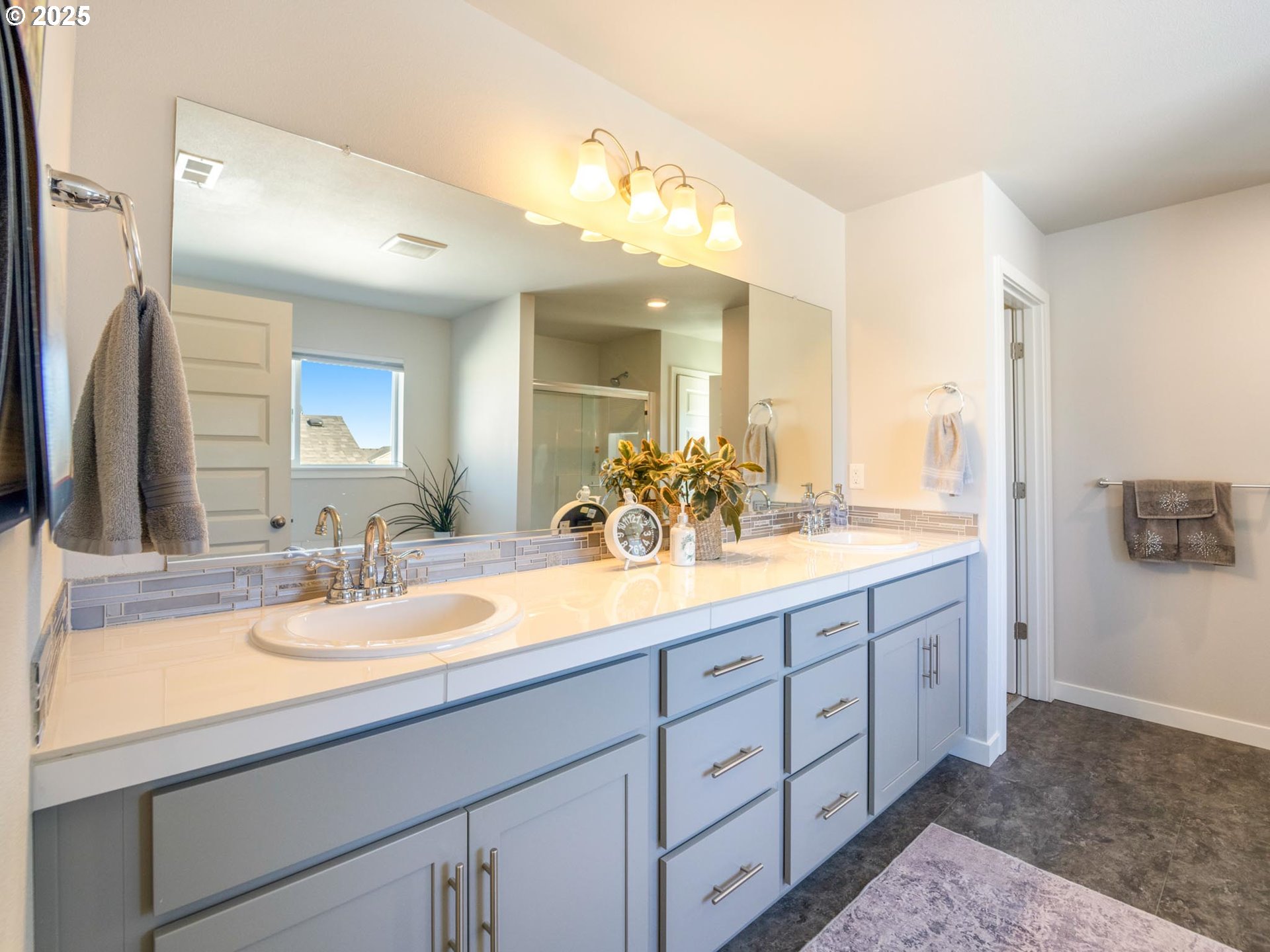856 Maple Street Brownsville, OR 97327 - Photo 15 of 47 a bathroom with a double vanity sink and a mirror
