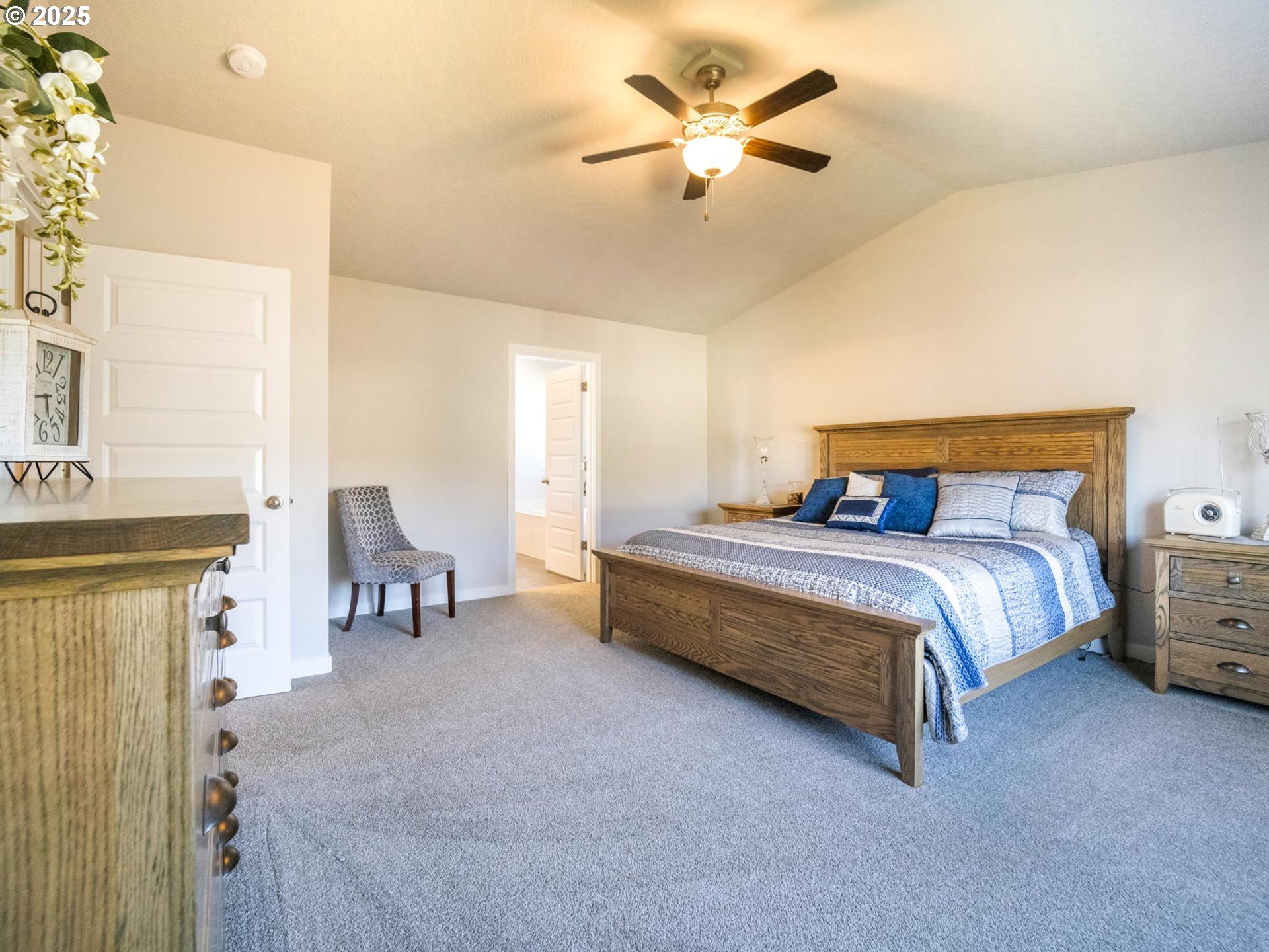 856 Maple Street Brownsville, OR 97327 - Photo 18 of 47 a bedroom with a bed and a chandelier