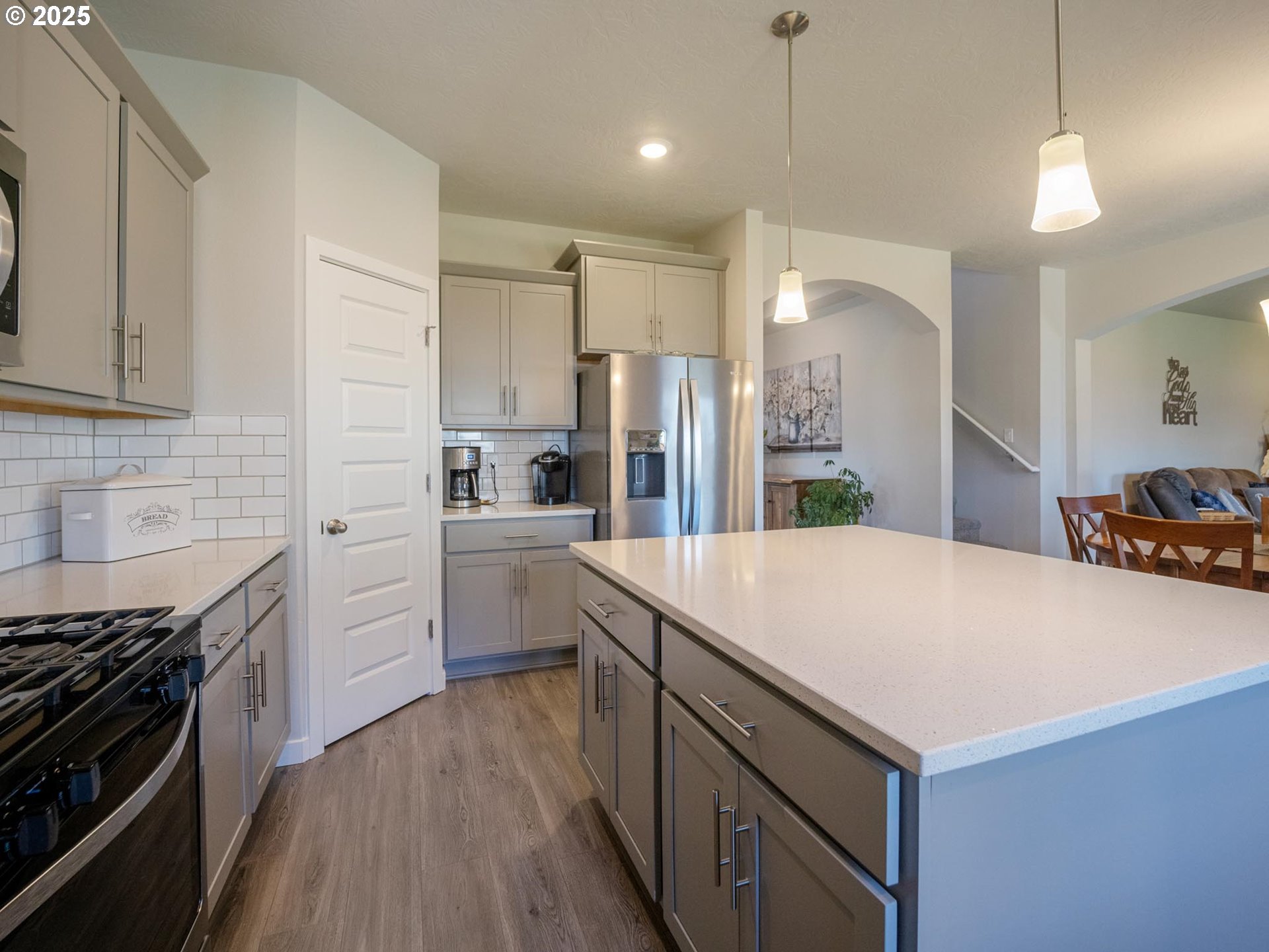 856 Maple Street Brownsville, OR 97327 - Photo 2 of 47 a kitchen with white cabinets and stainless steel appliances