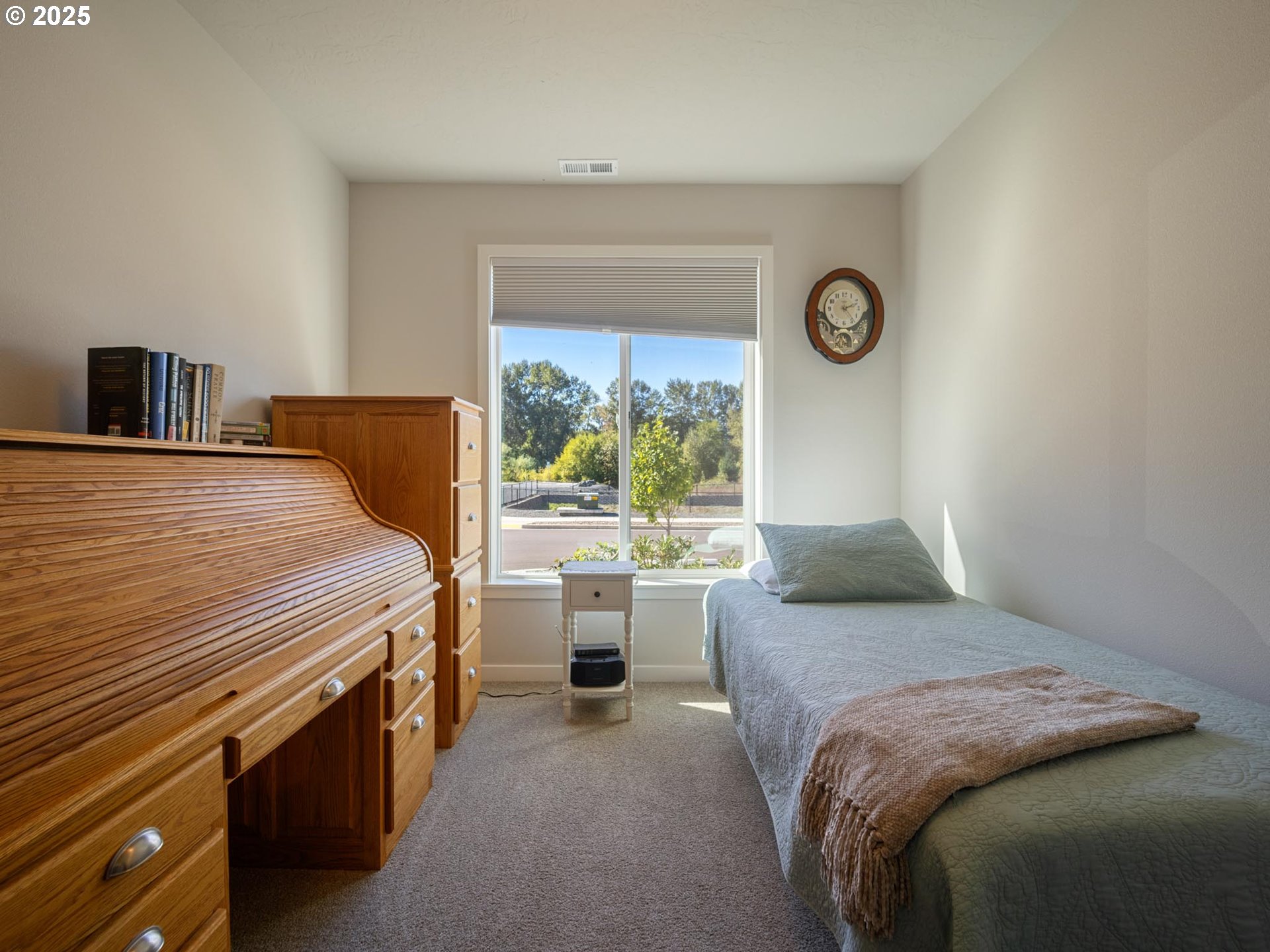856 Maple Street Brownsville, OR 97327 - Photo 33 of 47 a bedroom with a bed and a large window