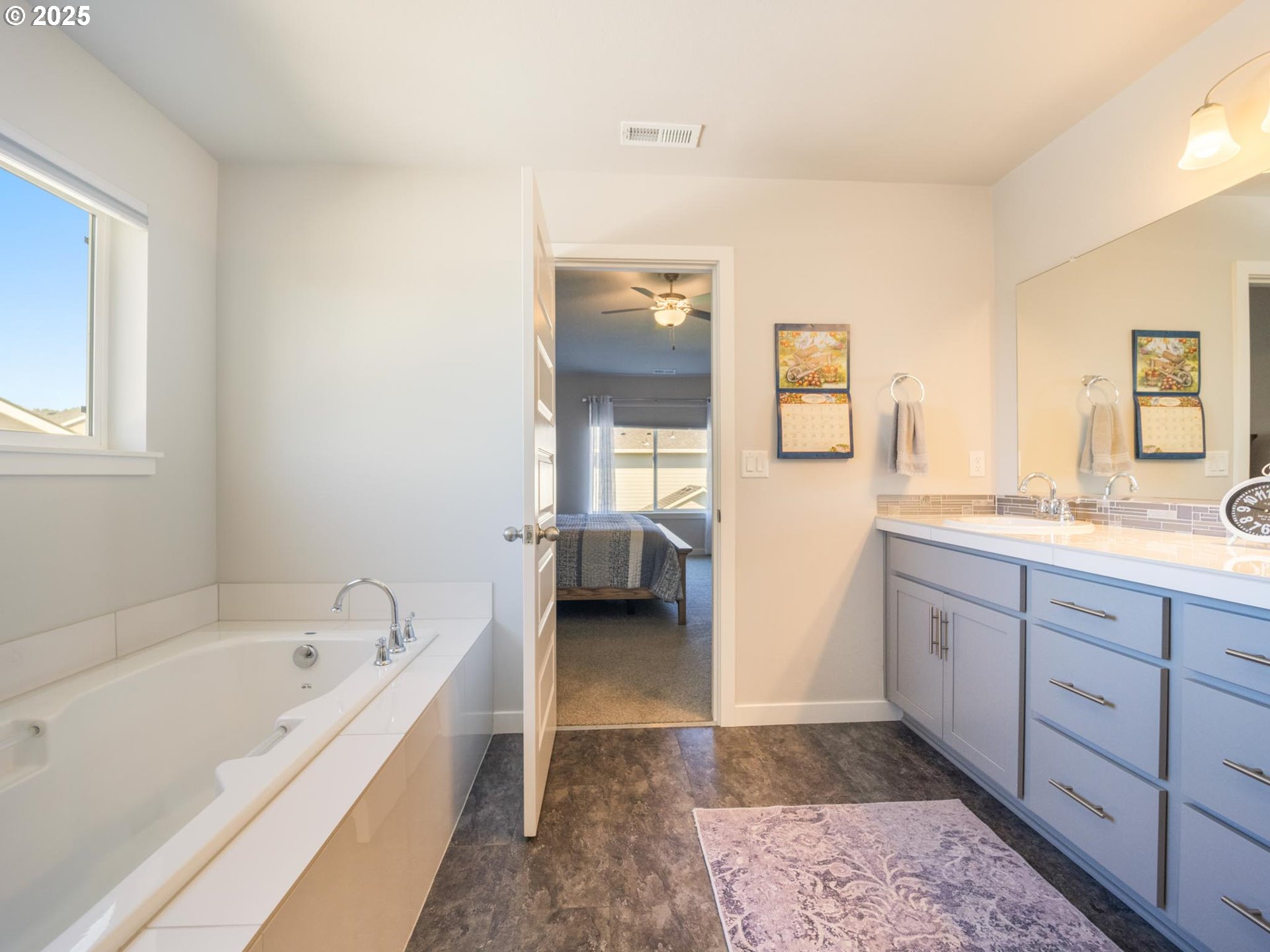 856 Maple Street Brownsville, OR 97327 - Photo 4 of 47 a spacious bathroom with a bathtub and a sink