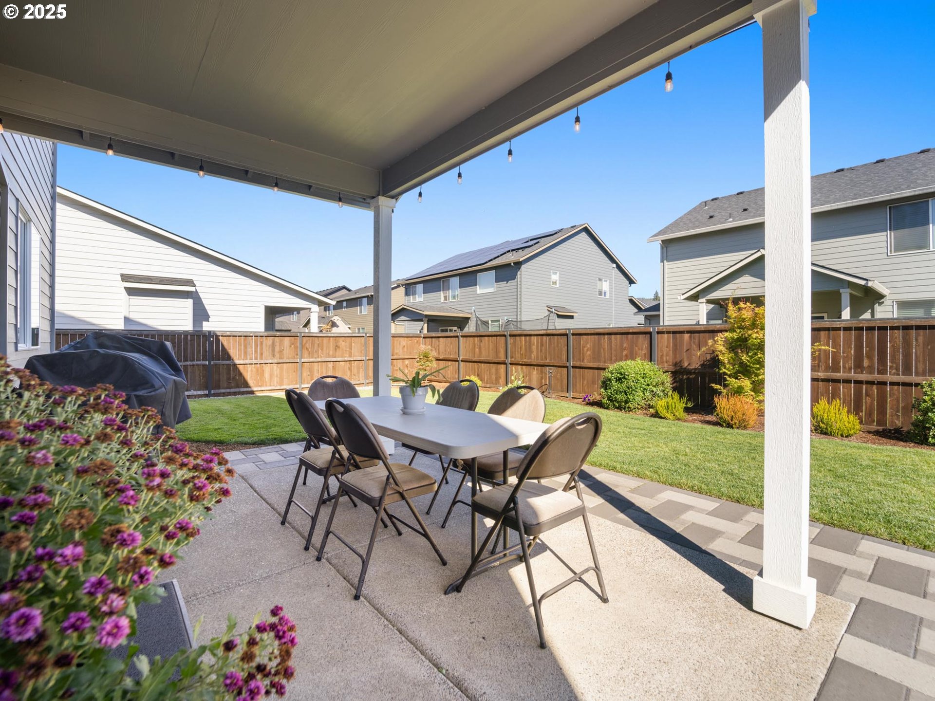 856 Maple Street Brownsville, OR 97327 - Photo 43 of 47 a roof deck with table and chairs and potted plants