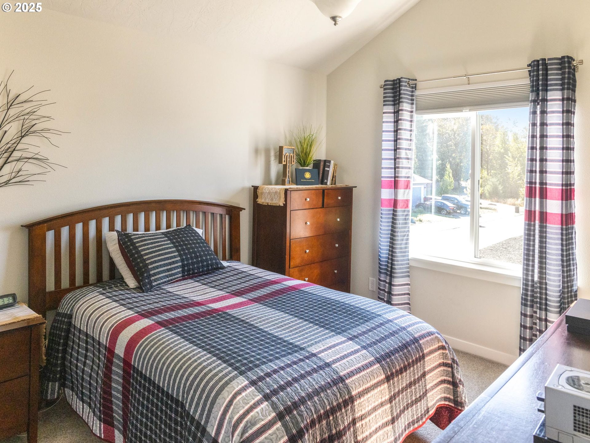 856 Maple Street Brownsville, OR 97327 - Photo 6 of 47 a bedroom with a large bed and a window