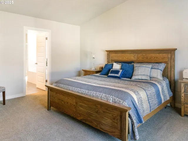 a bedroom with a bed and a table