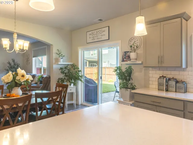 a kitchen with a table and chairs in it