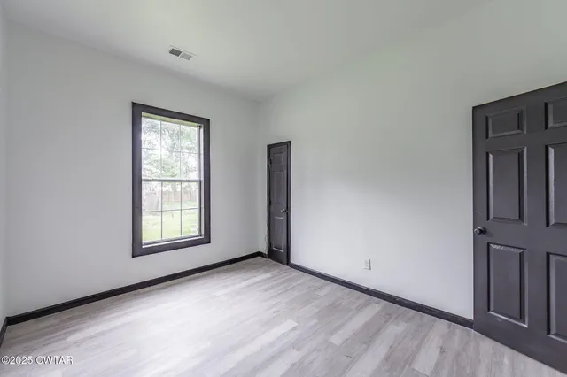 an empty room with windows