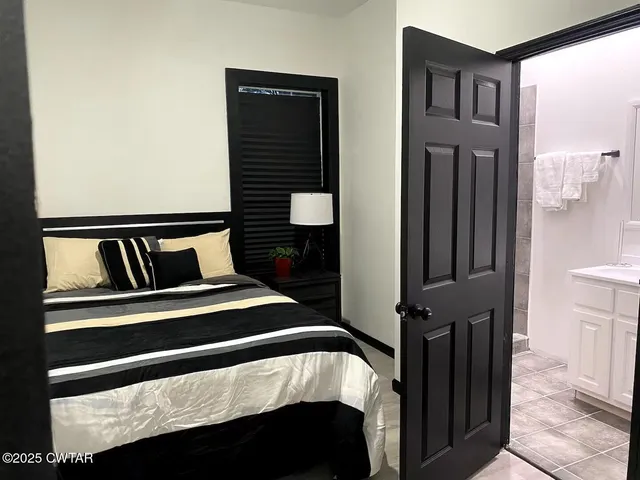 a front view of a house with entryway and wooden floor