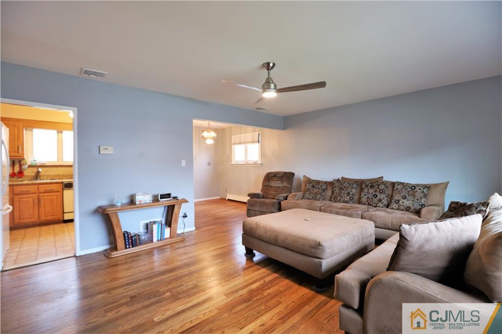 62 Stony Road Edison, NJ 08817 - Photo 2 of 26 a living room with furniture and a wooden floor