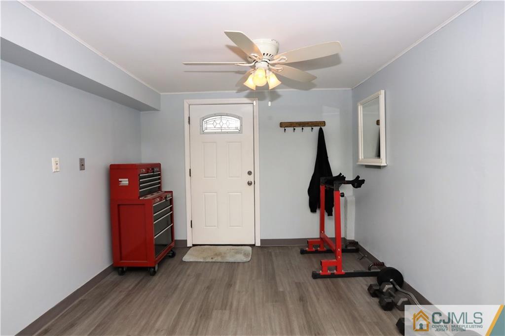 62 Stony Road Edison, NJ 08817 - Photo 15 of 26 a view of a room with wooden floor and white walls