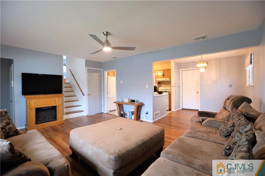 62 Stony Road Edison, NJ 08817 - Photo 3 of 26 a bedroom with a bed and a television