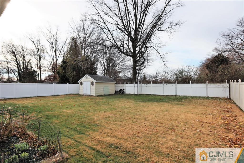 62 Stony Road Edison, NJ 08817 - Photo 21 of 26 a view of a house with a yard and a large tree