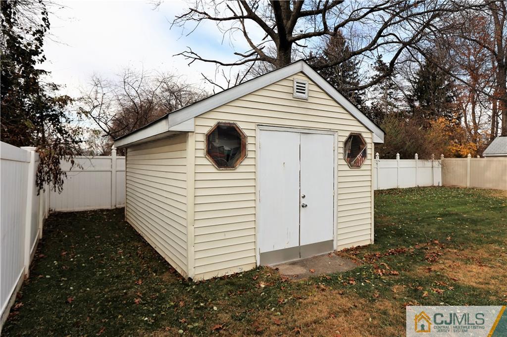 62 Stony Road Edison, NJ 08817 - Photo 23 of 26 a view of a white house with a yard and garage