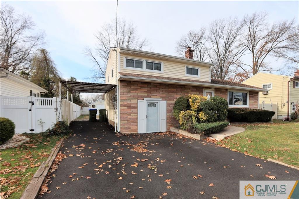 62 Stony Road Edison, NJ 08817 - Photo 24 of 26 a front view of a house with a yard