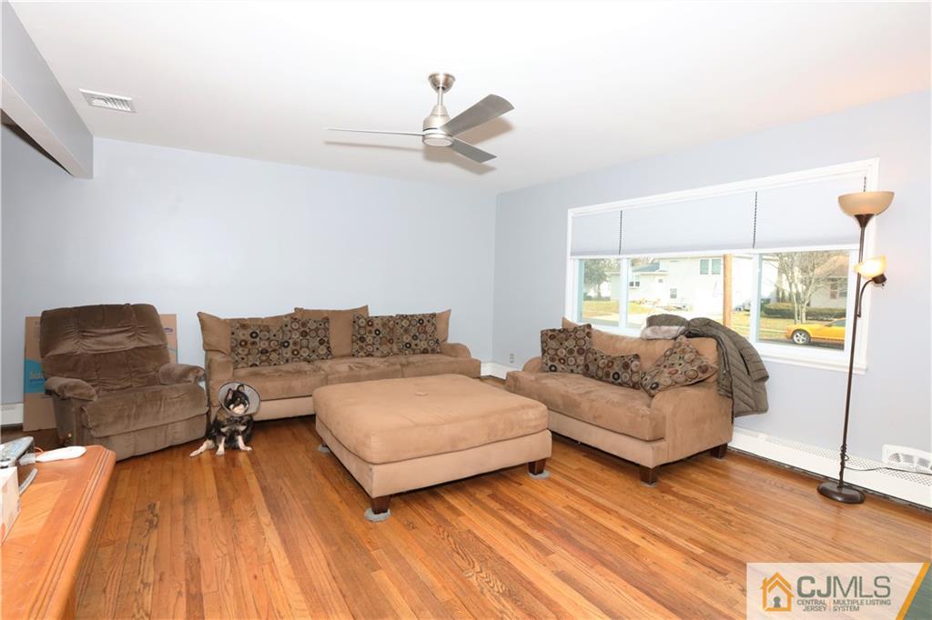 62 Stony Road Edison, NJ 08817 - Photo 5 of 26 a bedroom with furniture and a wooden floor