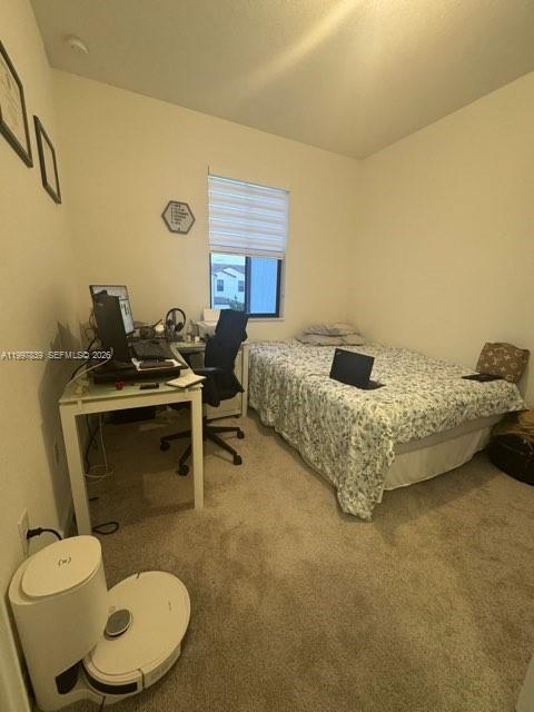 23012 Southwest 129th Place Miami, FL 33177 - Photo 3 of 9 a bedroom with a bed and a fireplace