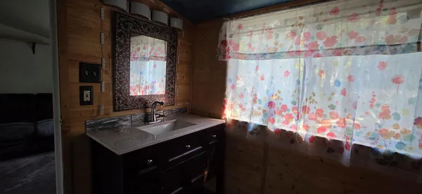 a bathroom with a sink and a mirror