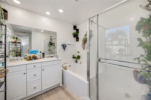 a bathroom with a bathtub and a shower