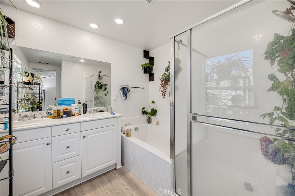 21192 Telegraph Road Riverside, CA 92507 - Photo 12 of 35 a bathroom with a bathtub and a shower