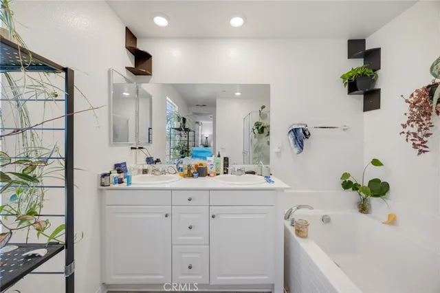 a white bath tub sitting in a bathroom