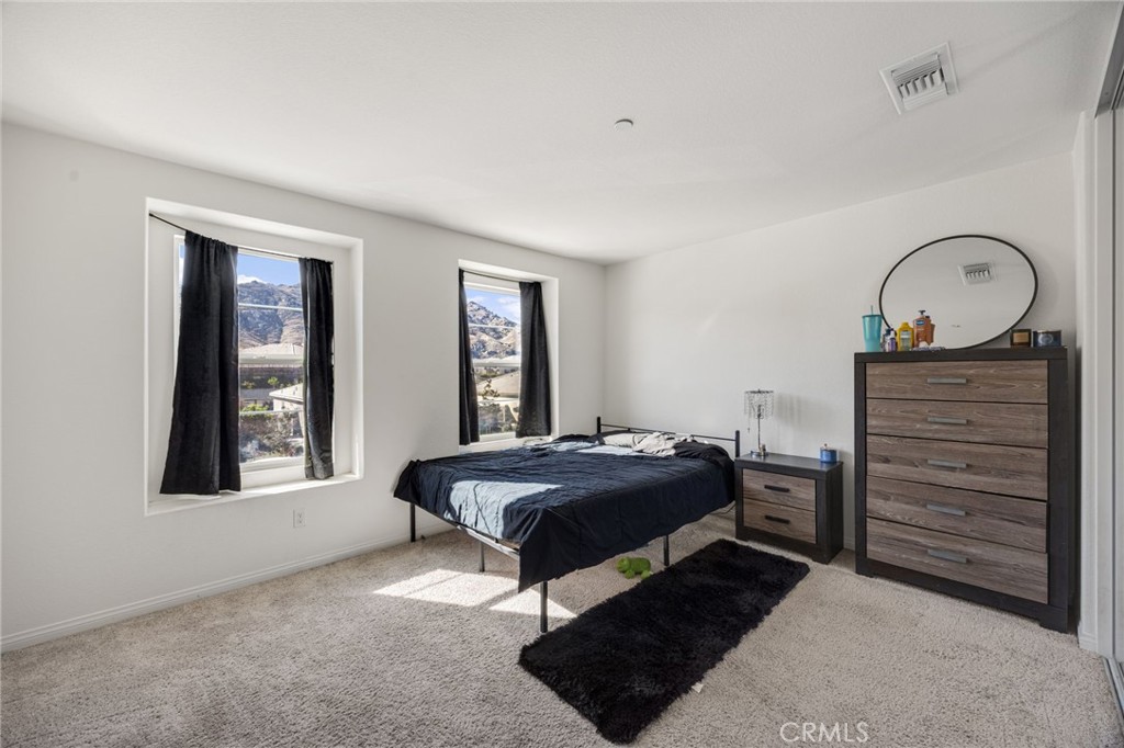 21192 Telegraph Road Riverside, CA 92507 - Photo 16 of 35 a bedroom with a bed window and dresser