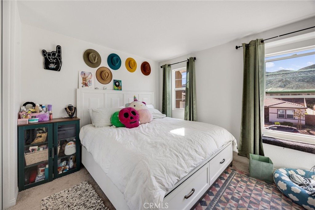 21192 Telegraph Road Riverside, CA 92507 - Photo 19 of 35 a bedroom with a bed and a window