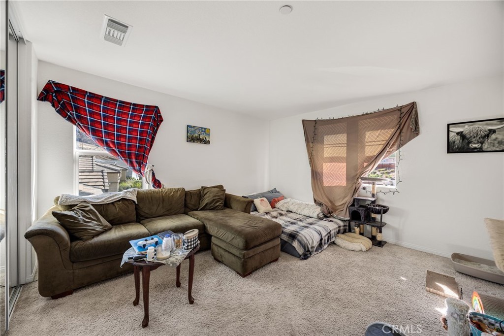 21192 Telegraph Road Riverside, CA 92507 - Photo 21 of 35 a living room with furniture a couch and a window