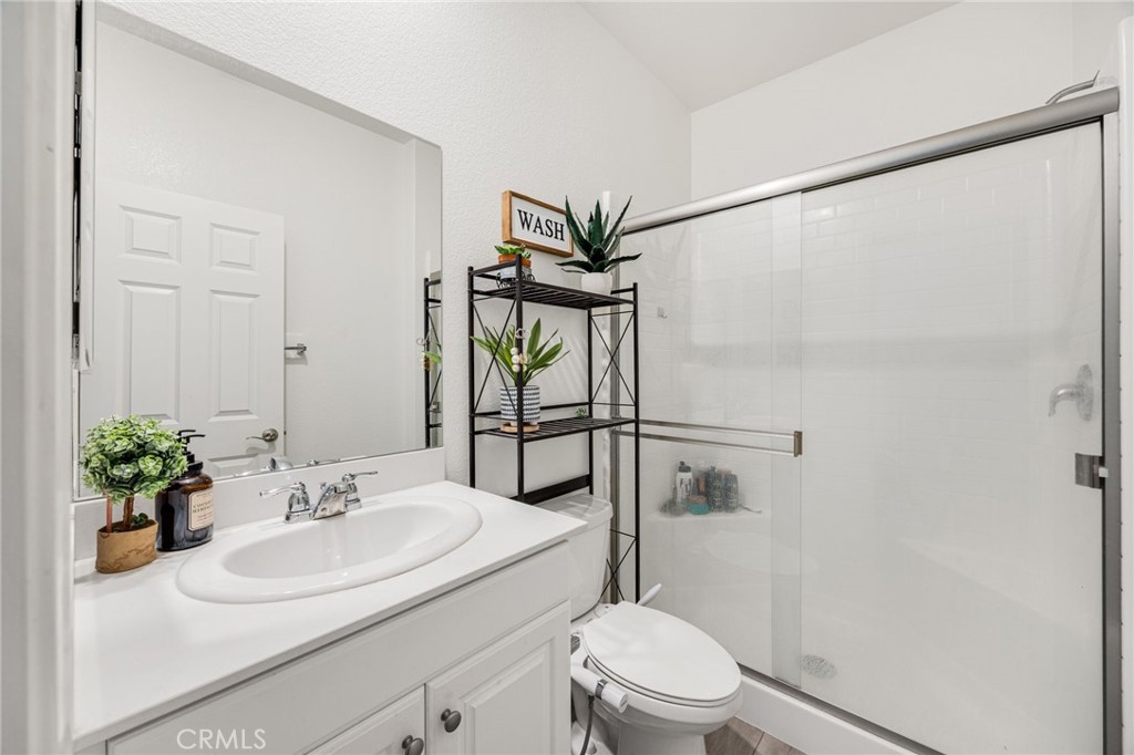 21192 Telegraph Road Riverside, CA 92507 - Photo 28 of 35 a bathroom with a sink toilet and shower