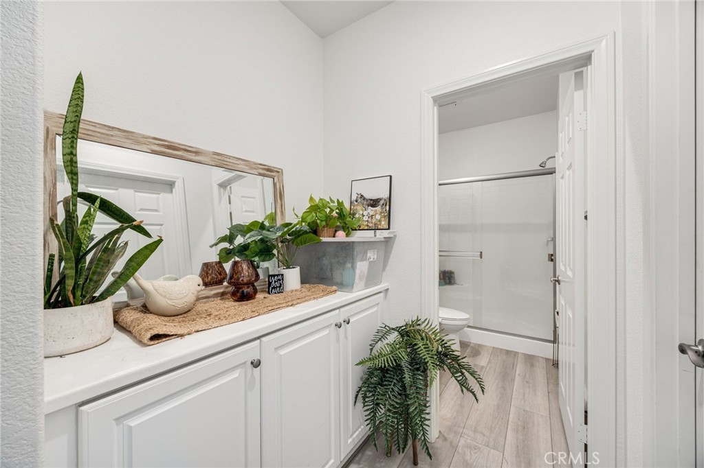 21192 Telegraph Road Riverside, CA 92507 - Photo 29 of 35 a kitchen with a potted plant on the counter and cabinets
