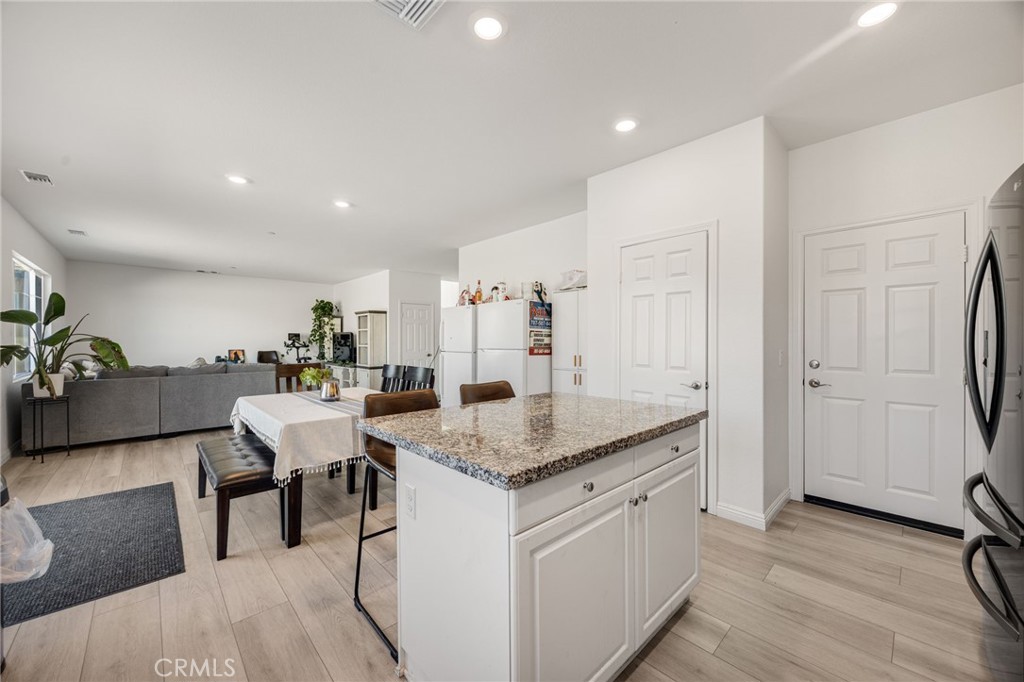 21192 Telegraph Road Riverside, CA 92507 - Photo 5 of 35 a kitchen with stainless steel appliances granite countertop a stove and a refrigerator