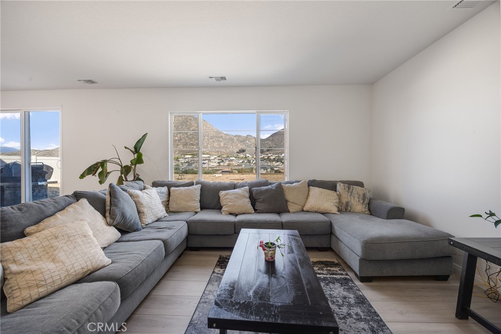 21192 Telegraph Road Riverside, CA 92507 - Photo 7 of 35 a living room with furniture and a large window