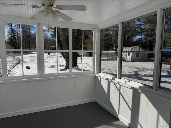 a view of a living room with a large window