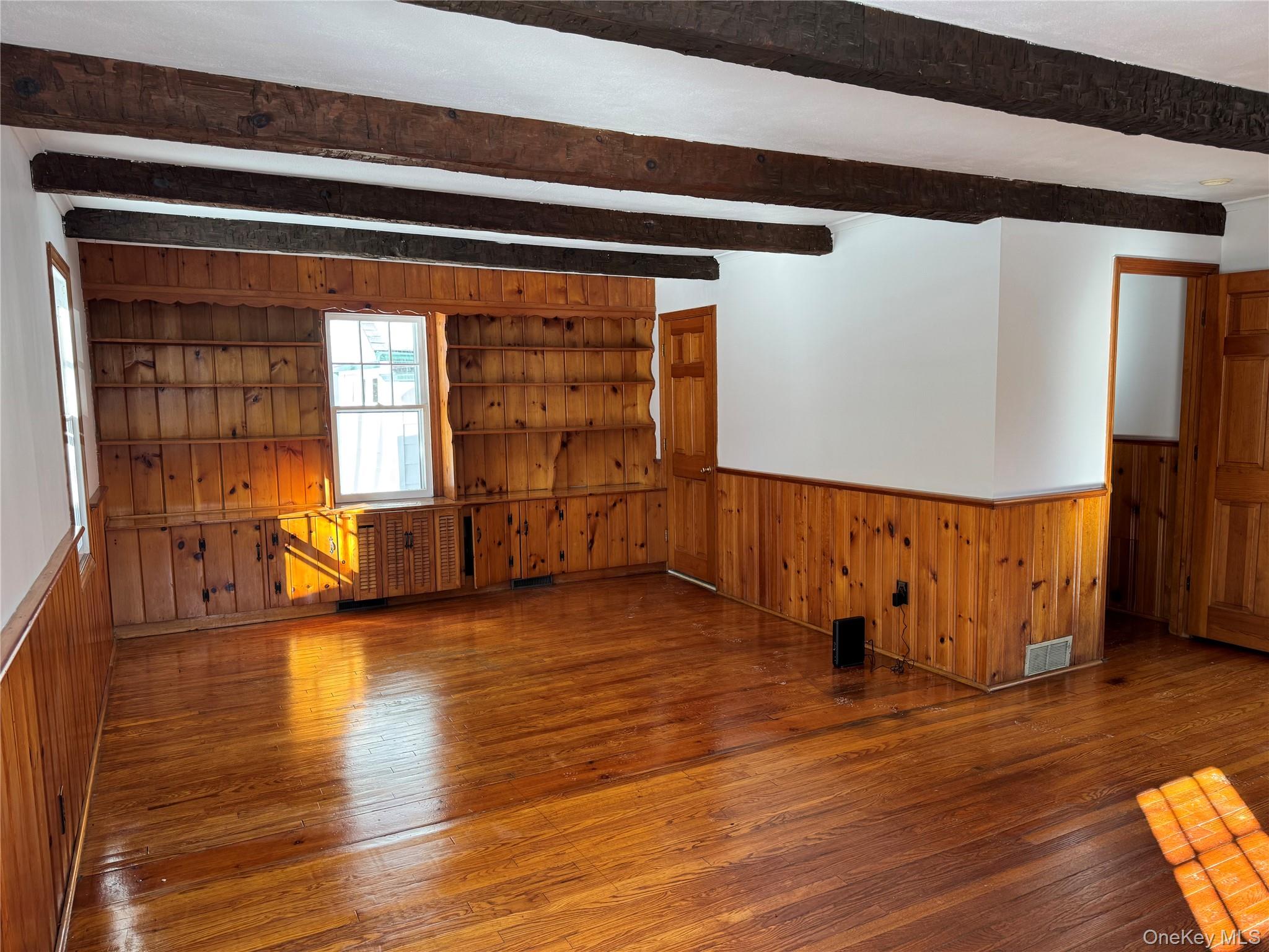 793 Fiddlers Bridge Road Rhinebeck, NY 12572 - Photo 9 of 24 Large Living Room with Wall of Built-in Shelving
