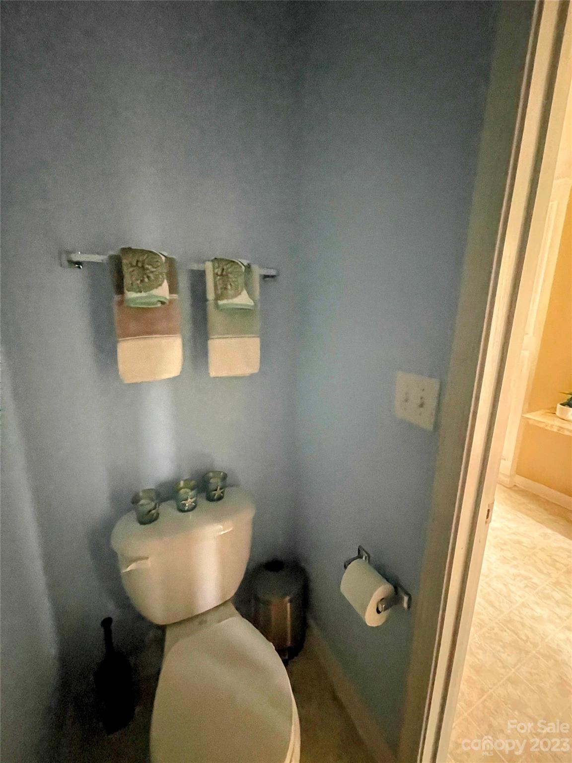 1002 Mearn Road, Unit 98 Charlotte, NC 28216 - Photo 5 of 9 a bathroom with a toilet mirror and sink