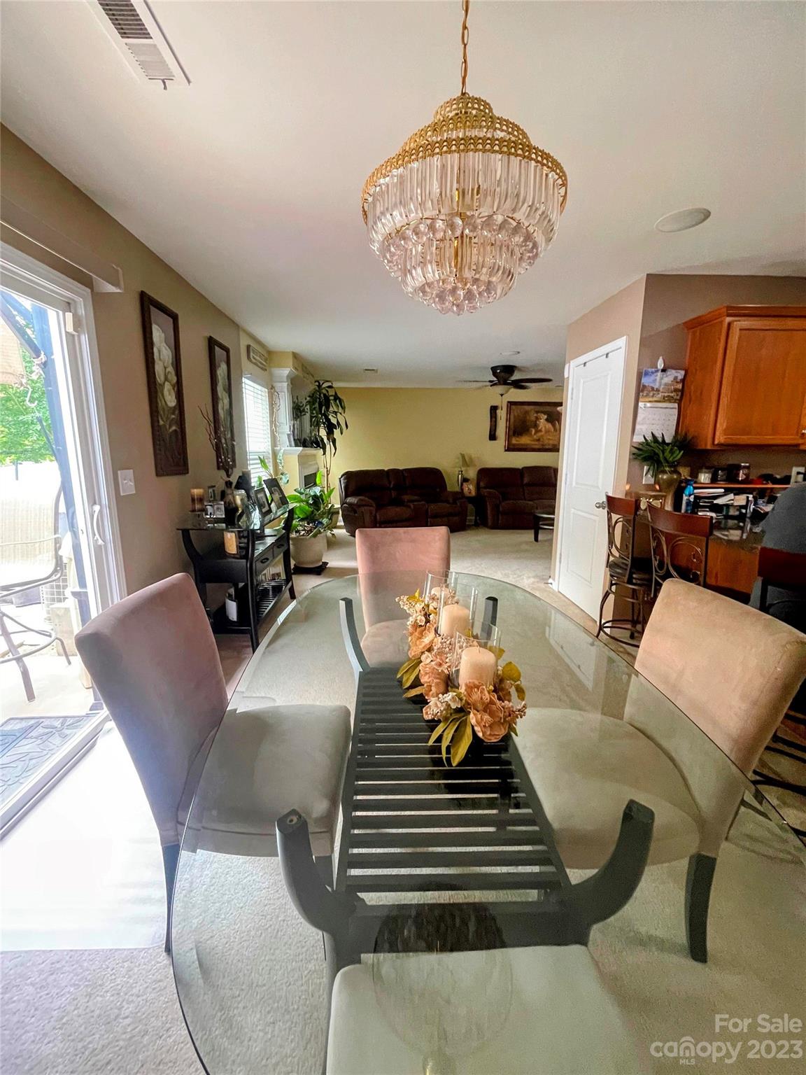 1002 Mearn Road, Unit 98 Charlotte, NC 28216 - Photo 6 of 9 a living room with furniture chandelier and a table