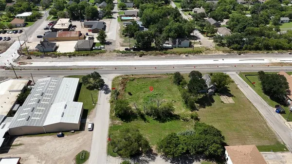 an aerial view of a house with outdoor space