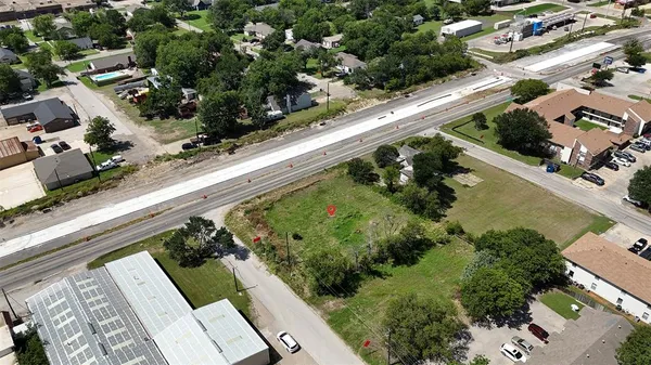an aerial view of a residential houses with outdoor space