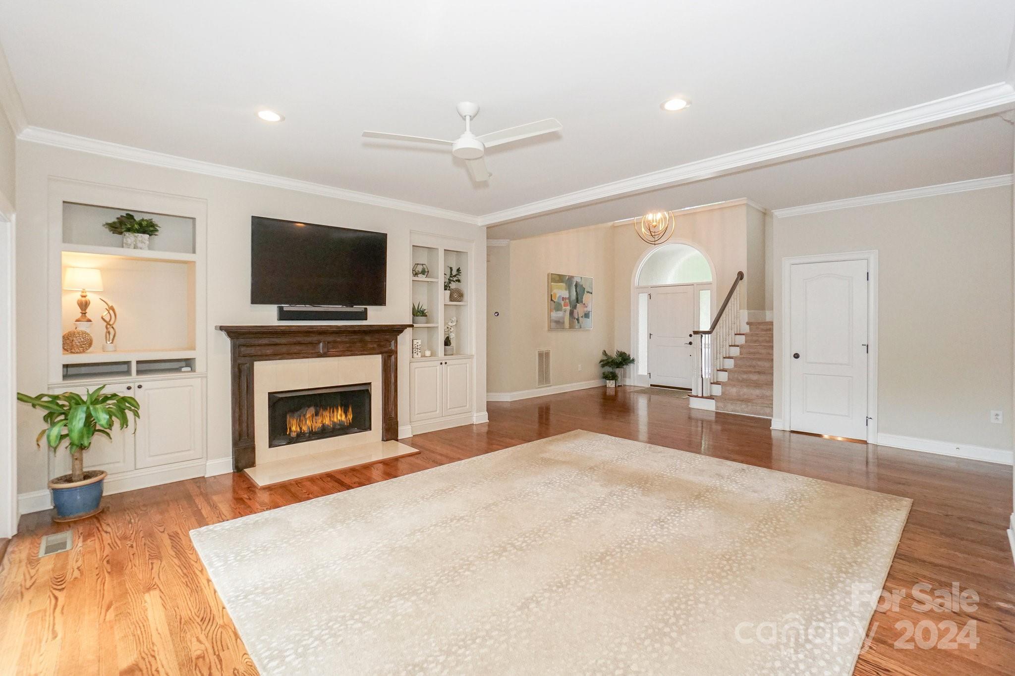 21910 Satilla Drive Cornelius, NC 28031 - Photo 13 of 47 a bedroom with a bed and a flat screen tv