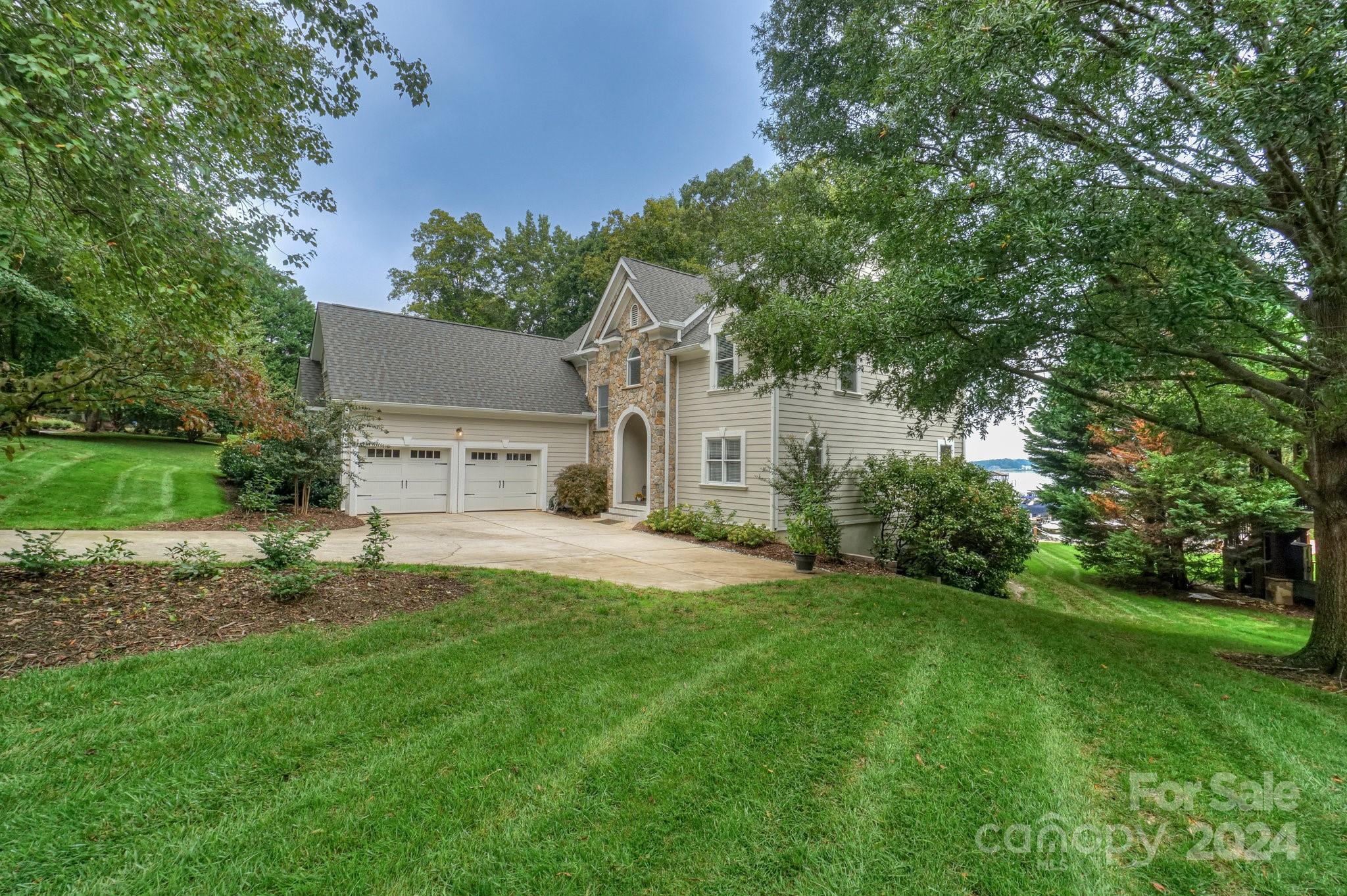 21910 Satilla Drive Cornelius, NC 28031 - Photo 3 of 47 a house view with a garden space
