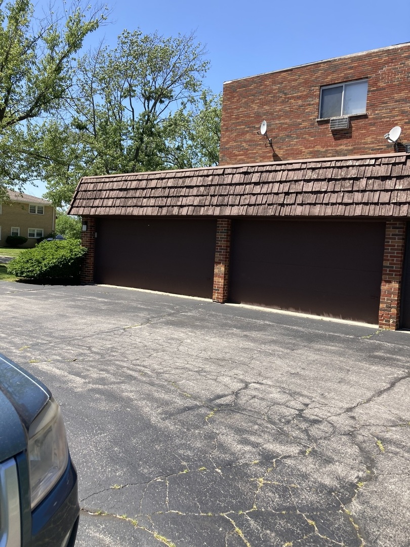 903 Elder Road, Unit 2 Homewood, IL 60430 - Photo 3 of 10 a front view of a house with a garage