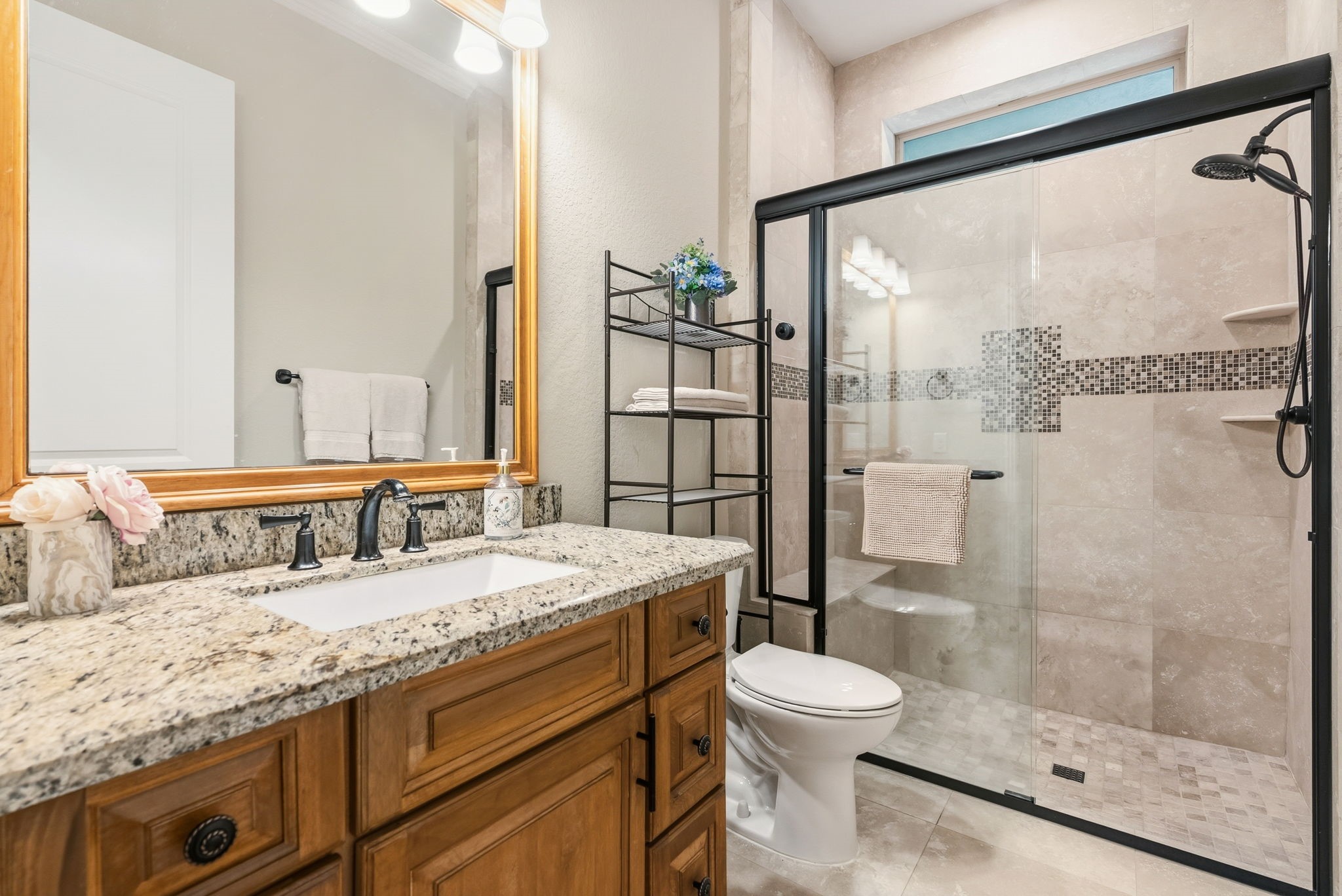 28502 Crawford Ridge Court Huffman, TX 77336 - Photo 38 of 50 a bathroom with a granite countertop sink toilet a mirror and shower