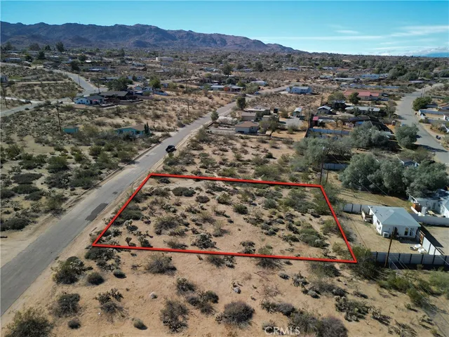 an aerial view of residential house with outdoor space