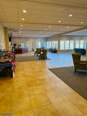 a reading room with furniture and book shelf