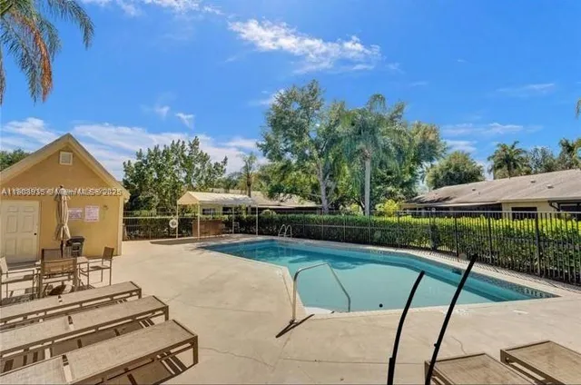 a view of a house with swimming pool